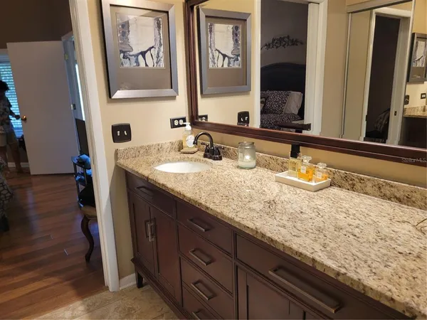 a bathroom with a sink and a mirror