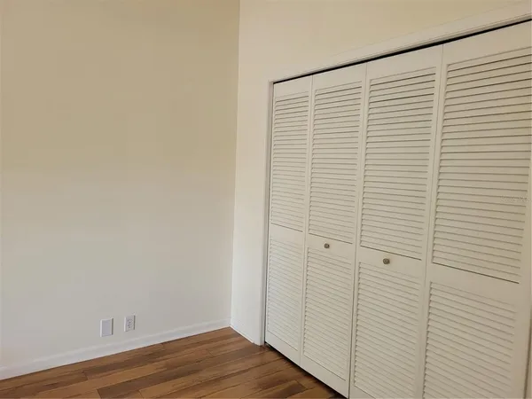 a view of a small space with wooden floor