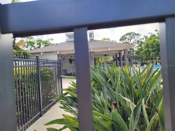 an aerial view of a house with swimming pool and patio