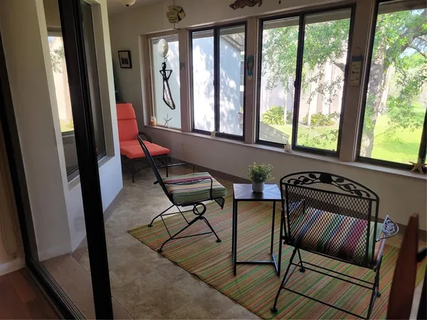 a living room with furniture and a window