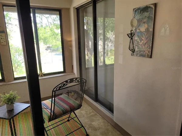 a view of an entryway with wooden floor