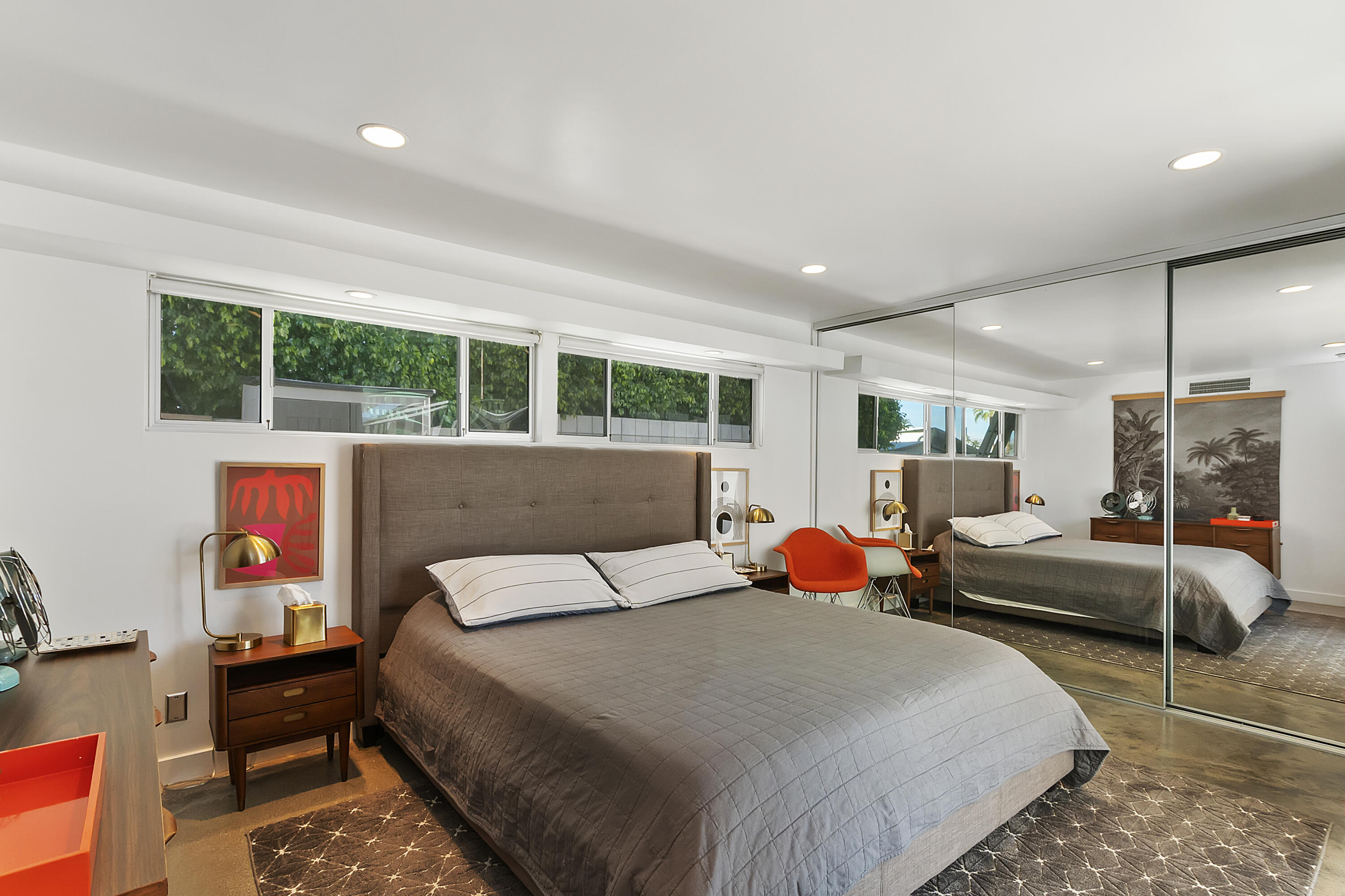 45876 Abronia Trail Palm Desert, CA 92260 - Photo 12 of 26 a bedroom with a bed a large window and potted plant on the dresser