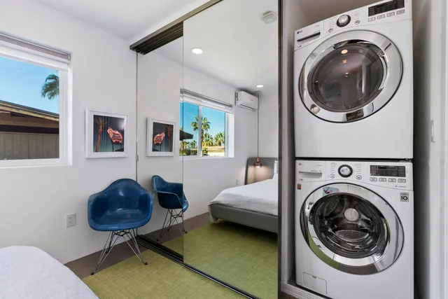 a living room with furniture and a chair