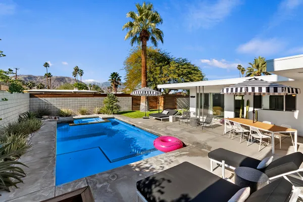 a view of a chairs and table in the patio