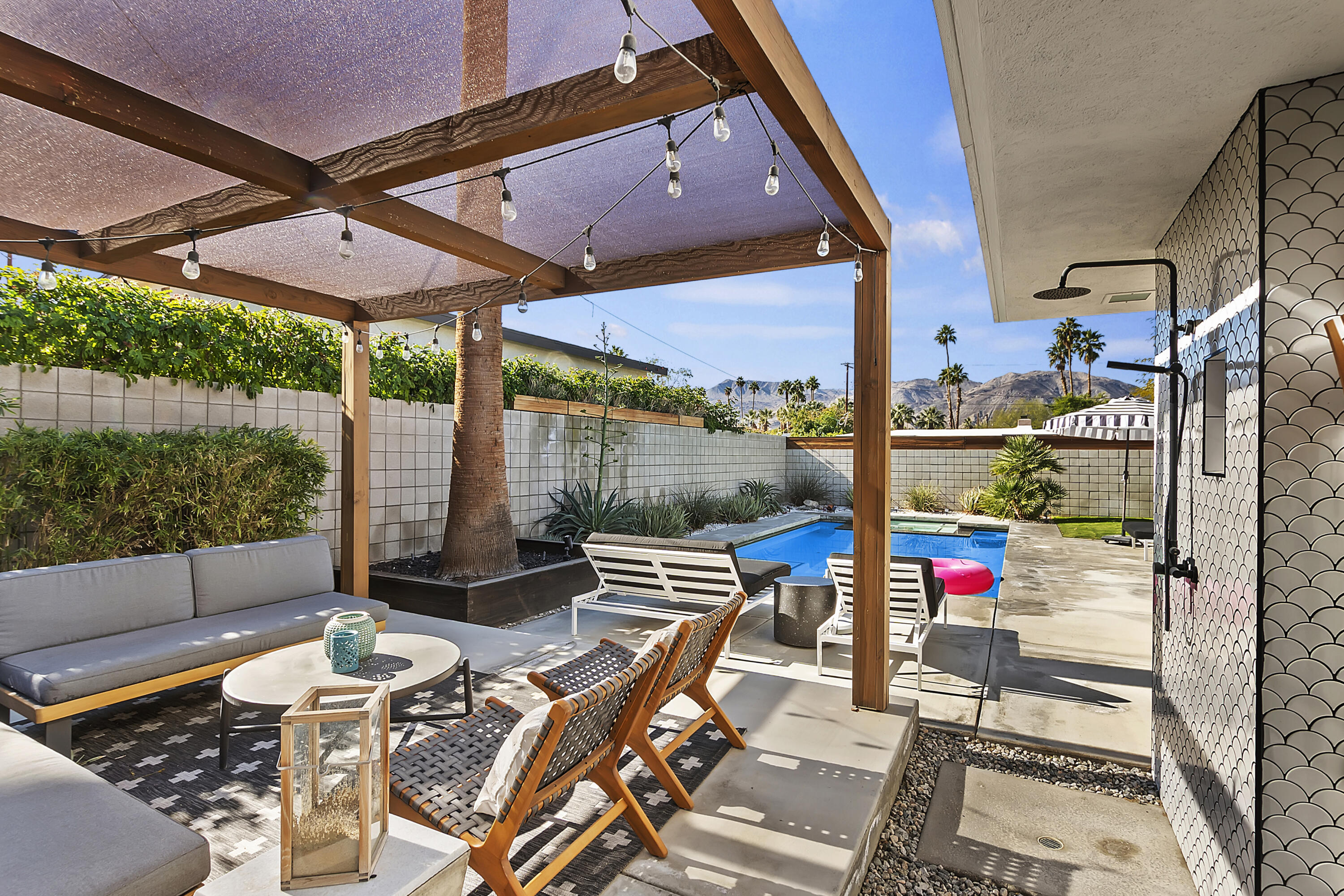 45876 Abronia Trail Palm Desert, CA 92260 - Photo 22 of 26 an outdoor space with seating area and glass door