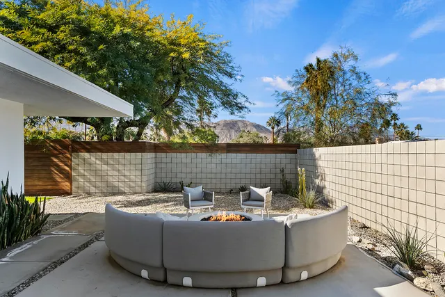 a view of outdoor sitting area with fire pit