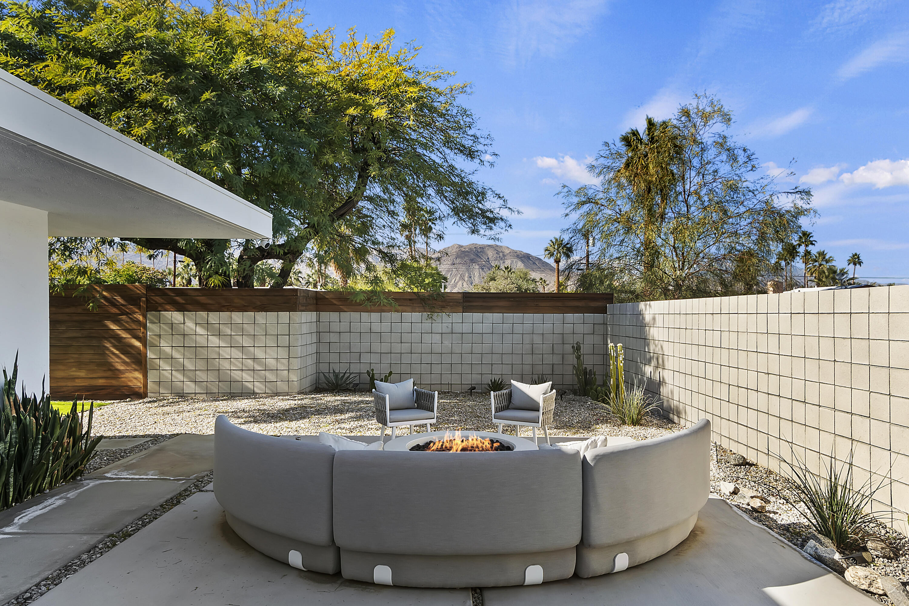 45876 Abronia Trail Palm Desert, CA 92260 - Photo 5 of 26 a view of outdoor sitting area with fire pit