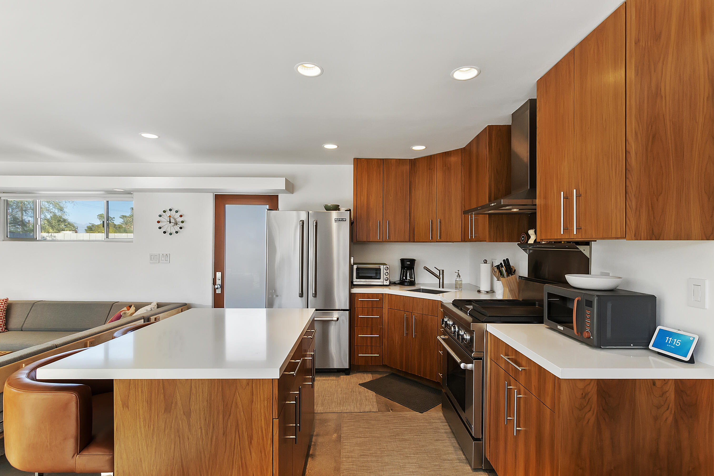 45876 Abronia Trail Palm Desert, CA 92260 - Photo 10 of 26 a kitchen with a sink a stove and cabinets