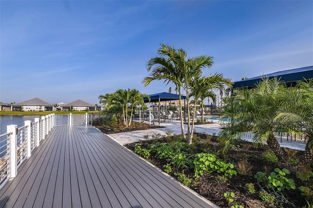 18154 Cherished Loop Lakewood Ranch, FL 34211 - Photo 7 of 21 a view of balcony with wooden floor and outdoor space