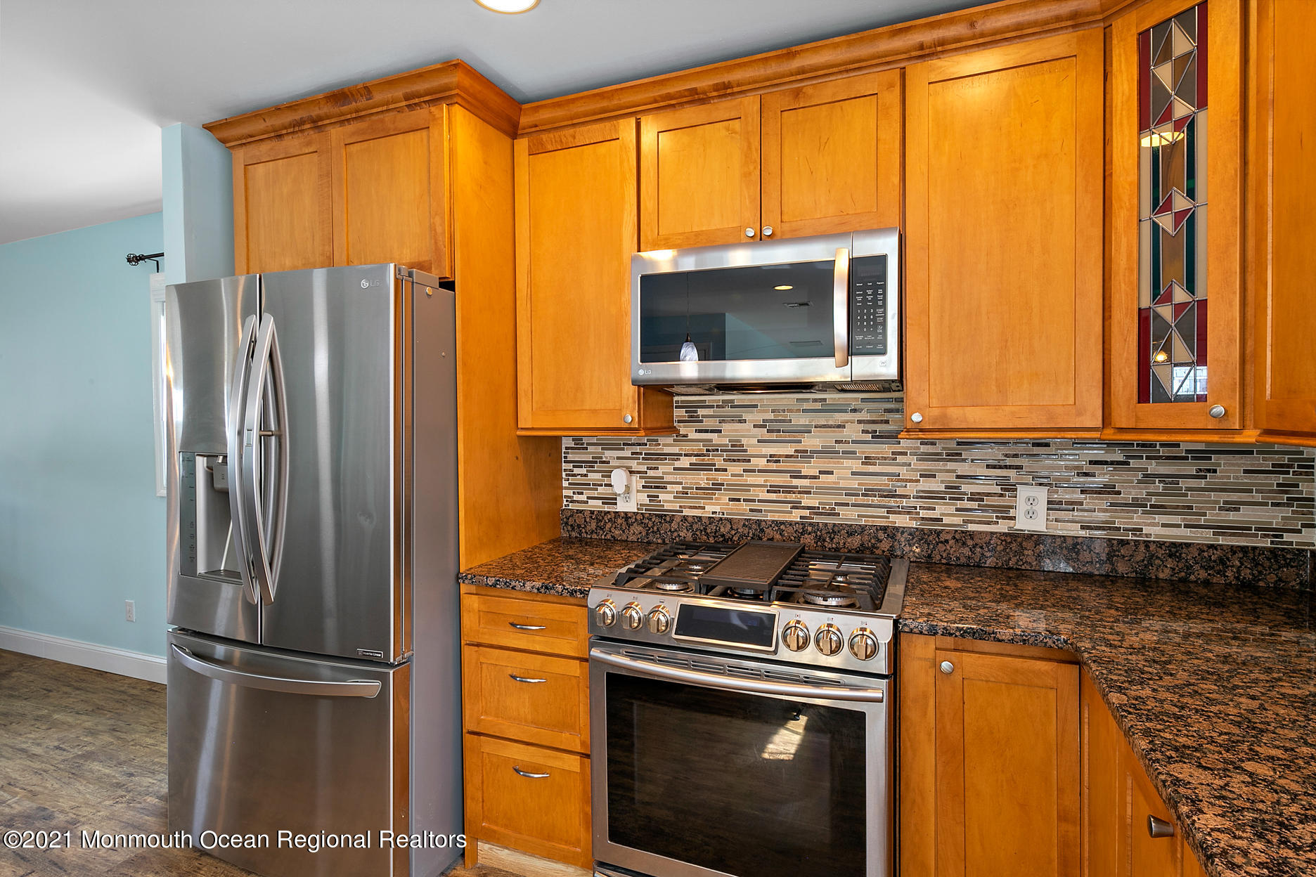 94 Jackson Street Fair Haven, NJ 07704 - Photo 12 of 83 a kitchen with stainless steel appliances granite countertop a refrigerator a stove and a microwave