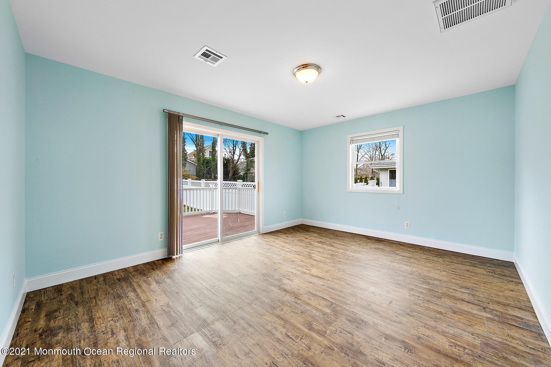 94 Jackson Street Fair Haven, NJ 07704 - Photo 15 of 83 a view of an empty room with wooden floor and a window