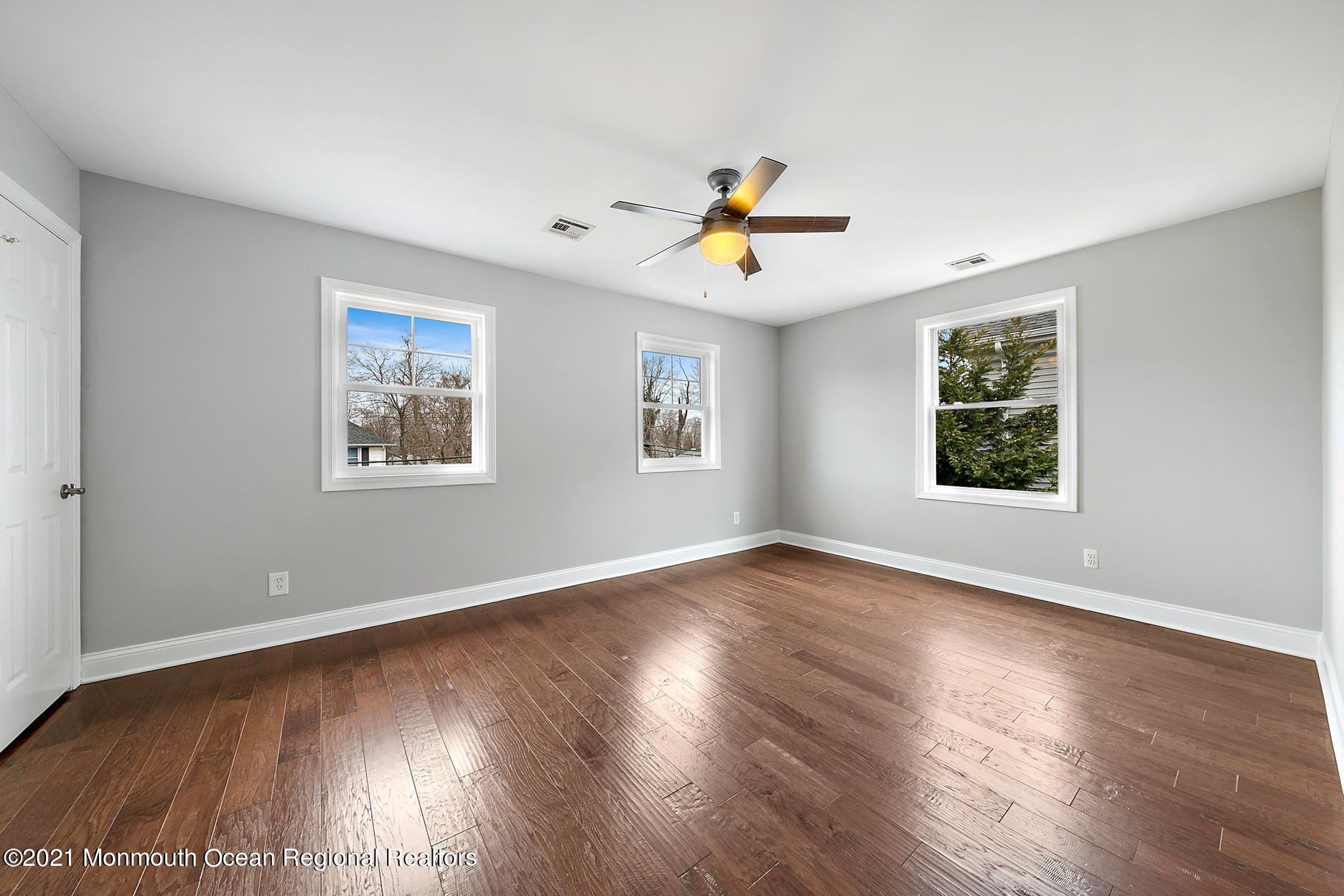 94 Jackson Street Fair Haven, NJ 07704 - Photo 28 of 83 a view of an empty room with window and wooden floor