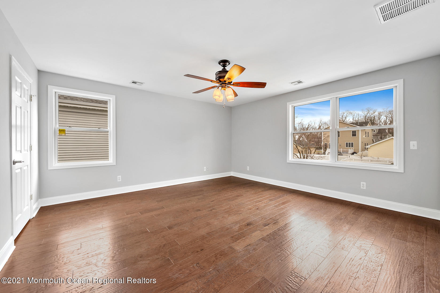 94 Jackson Street Fair Haven, NJ 07704 - Photo 29 of 83 a view of an empty room with a window and wooden floor