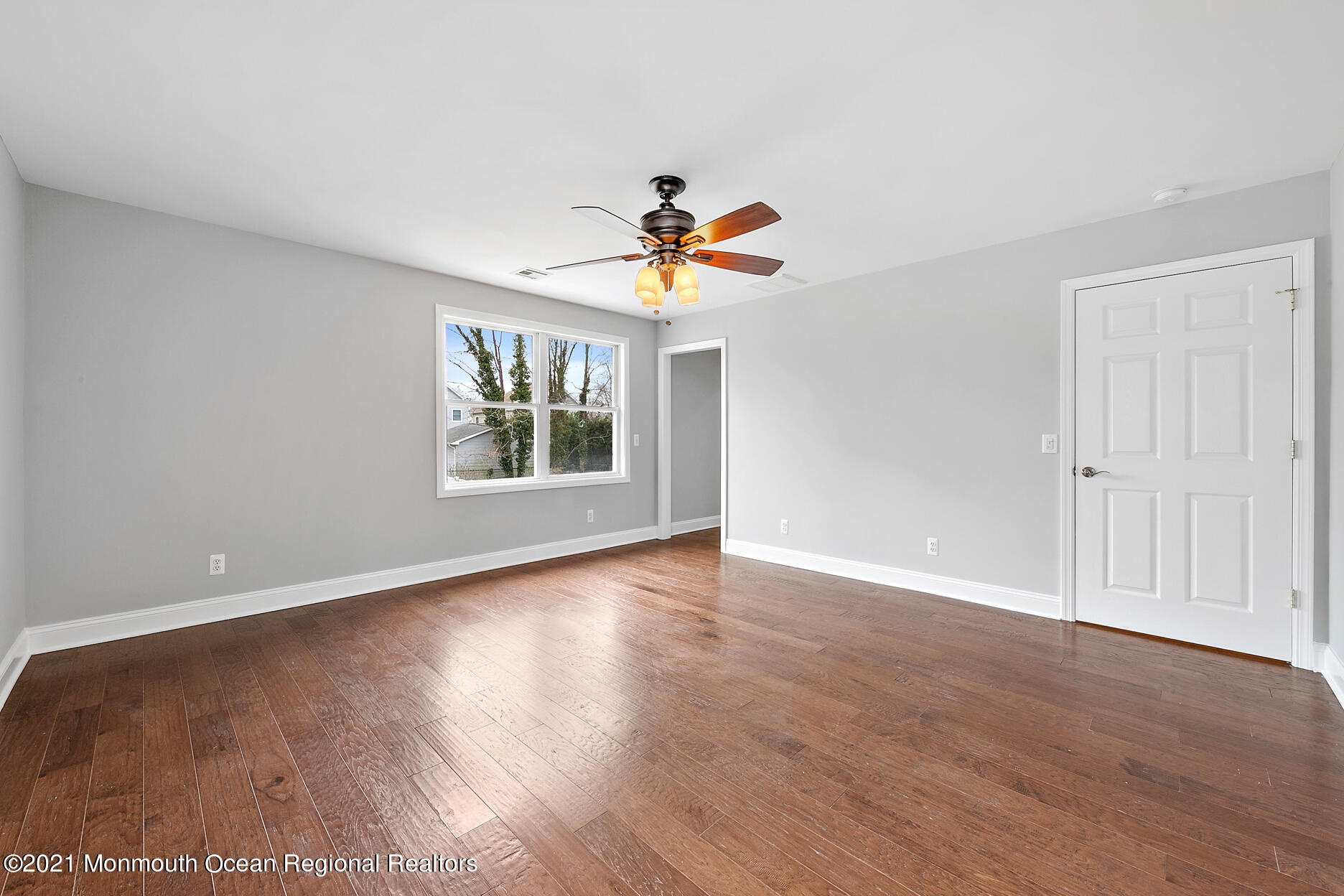94 Jackson Street Fair Haven, NJ 07704 - Photo 30 of 83 a view of an empty room with window and wooden floor