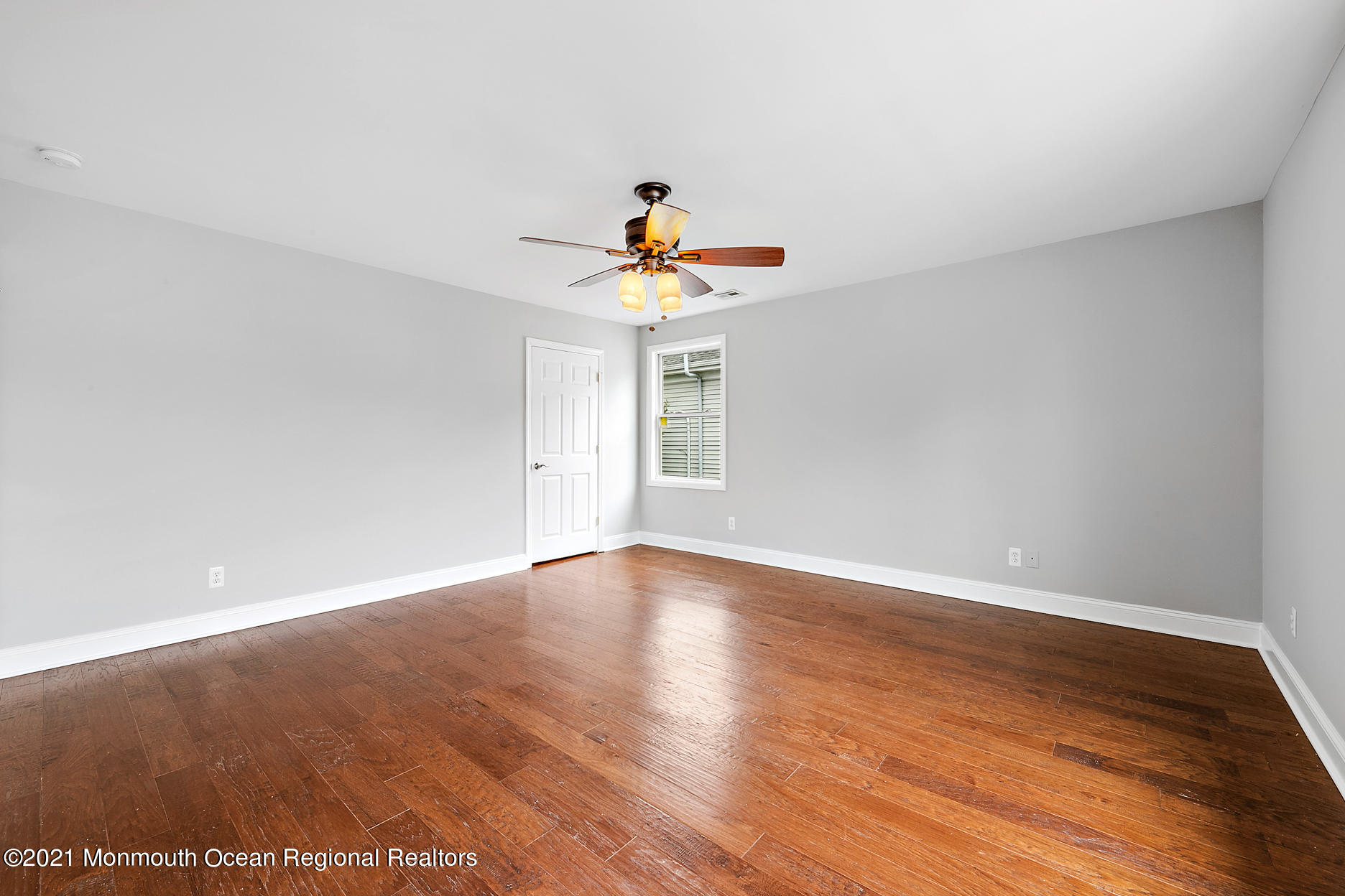 94 Jackson Street Fair Haven, NJ 07704 - Photo 32 of 83 a view of an empty room with wooden floor and a ceiling fan