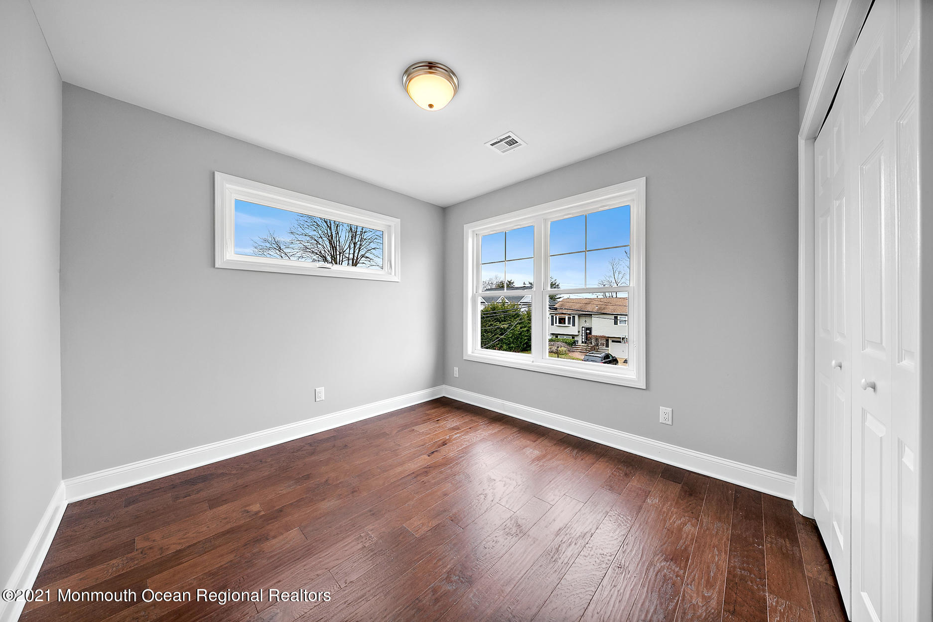 94 Jackson Street Fair Haven, NJ 07704 - Photo 36 of 83 a view of an empty room with wooden floor and a window