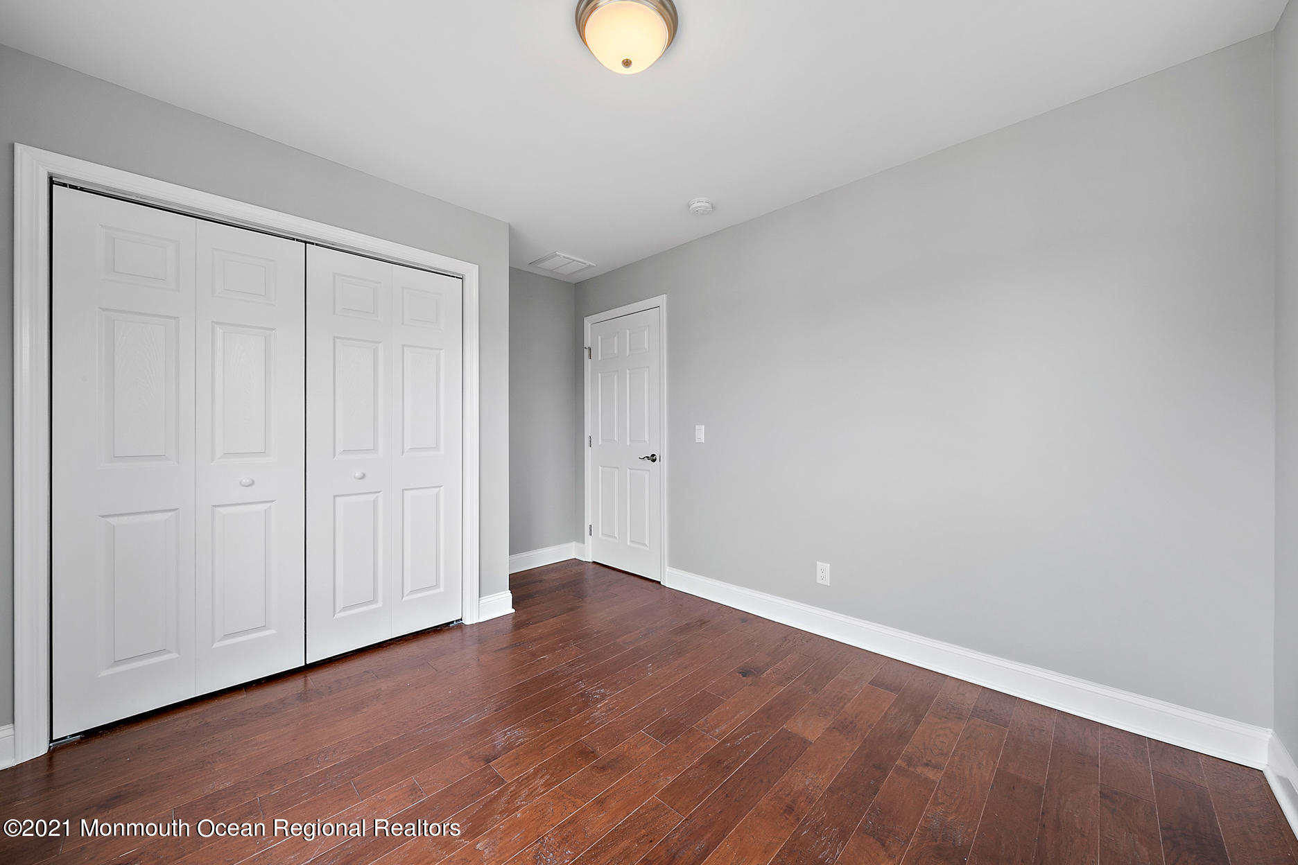 94 Jackson Street Fair Haven, NJ 07704 - Photo 38 of 83 a view of an empty room with wooden floor