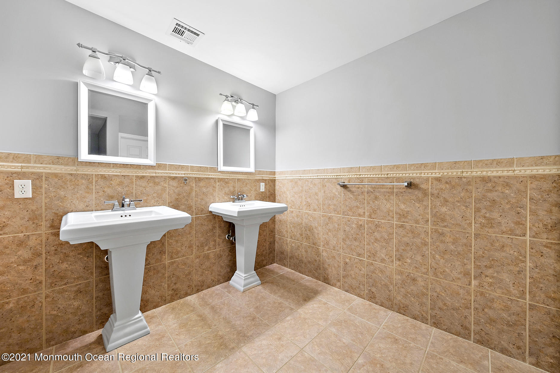 94 Jackson Street Fair Haven, NJ 07704 - Photo 40 of 83 a bathroom with a sink a mirror and shower