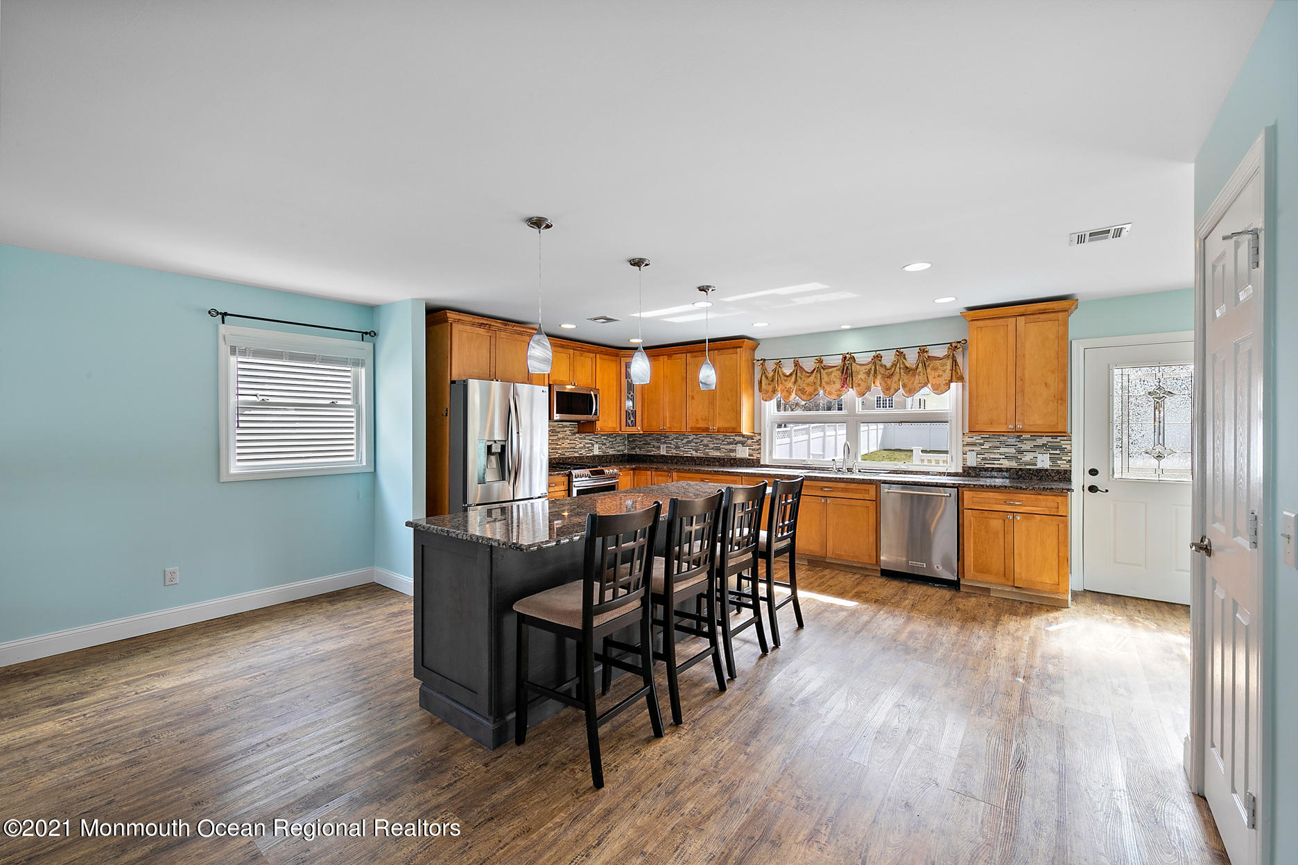 94 Jackson Street Fair Haven, NJ 07704 - Photo 7 of 83 a kitchen with stainless steel appliances wooden floor dining table and chairs
