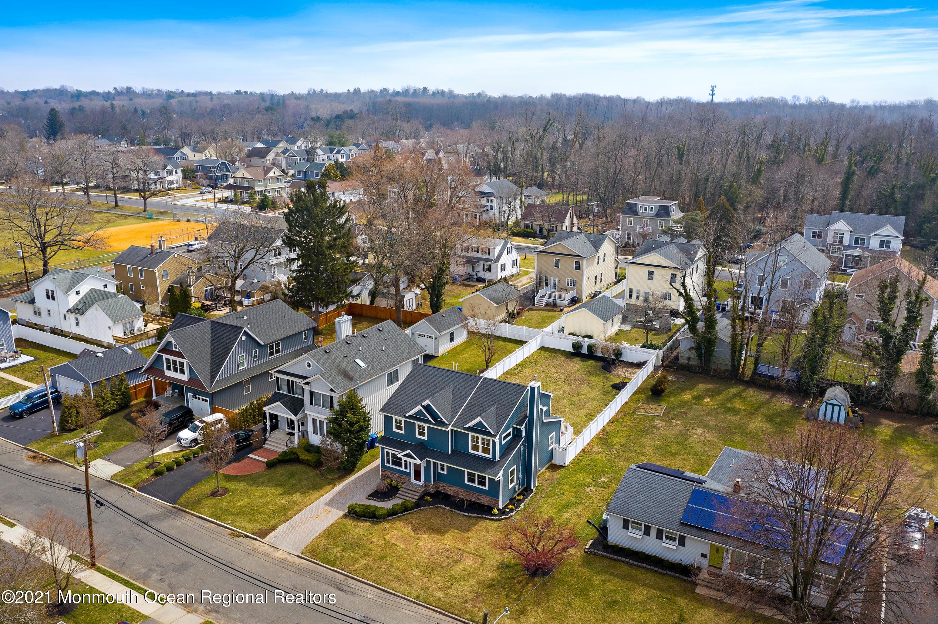 94 Jackson Street Fair Haven, NJ 07704 - Photo 66 of 83 an aerial view of a house with a swimming pool outdoor seating and mountain view