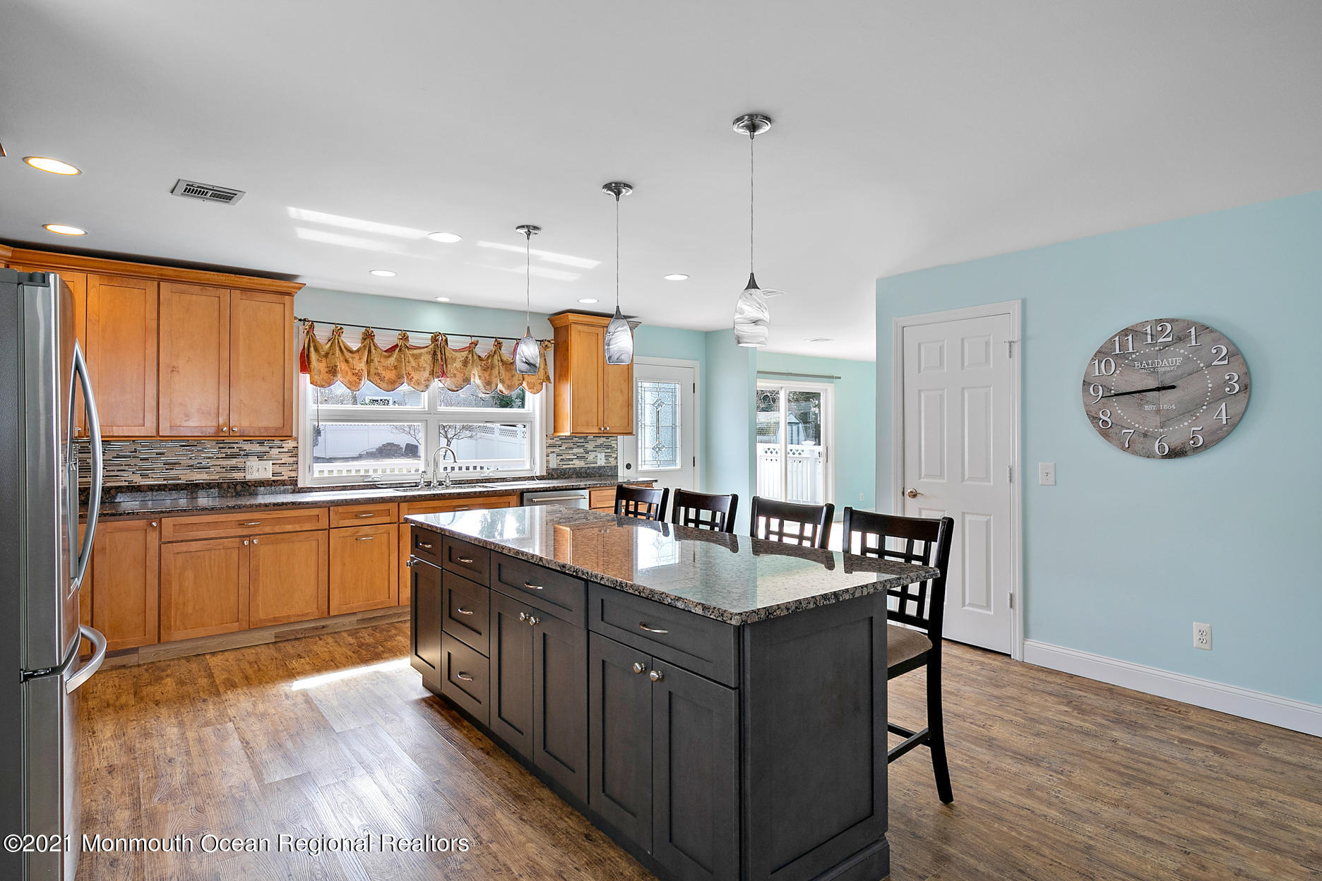 94 Jackson Street Fair Haven, NJ 07704 - Photo 8 of 83 a large kitchen with stainless steel appliances granite countertop a stove a sink dishwasher and a large refrigerator with wooden floor