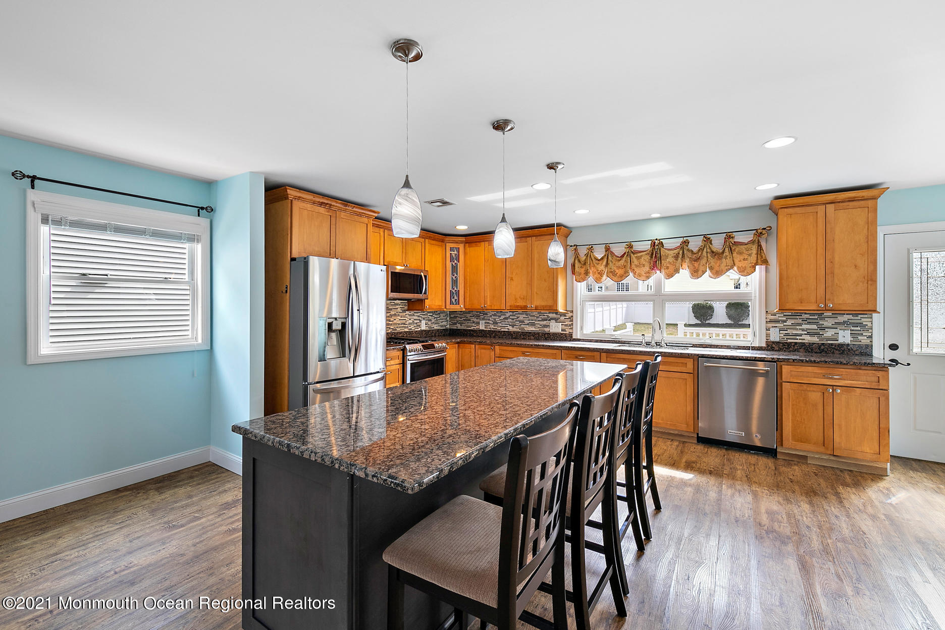 94 Jackson Street Fair Haven, NJ 07704 - Photo 9 of 83 a kitchen with granite countertop kitchen island wooden floor center island and stainless steel appliances