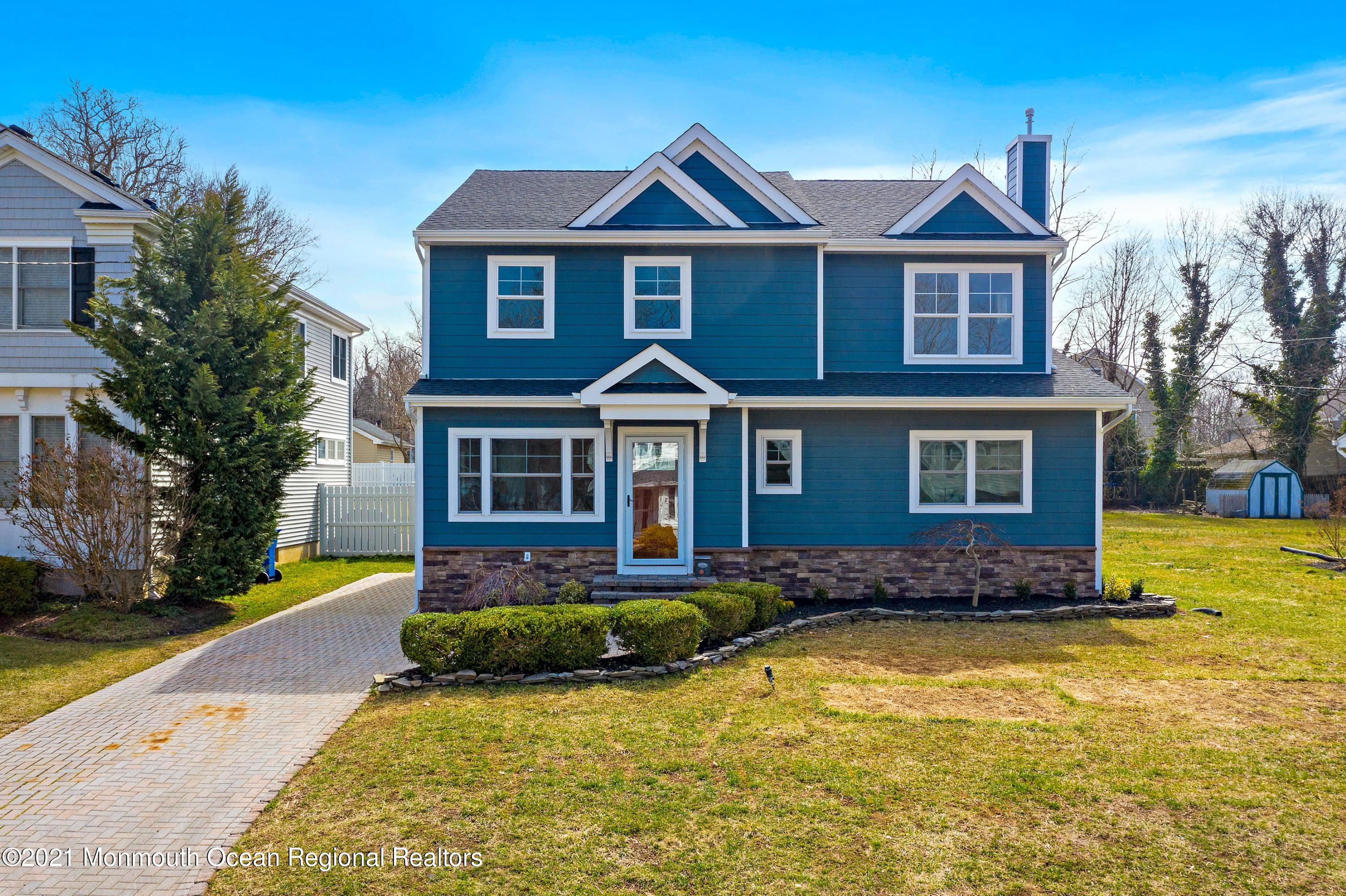 94 Jackson Street Fair Haven, NJ 07704 - Photo 81 of 83 a front view of a house with a yard outdoor seating and garage