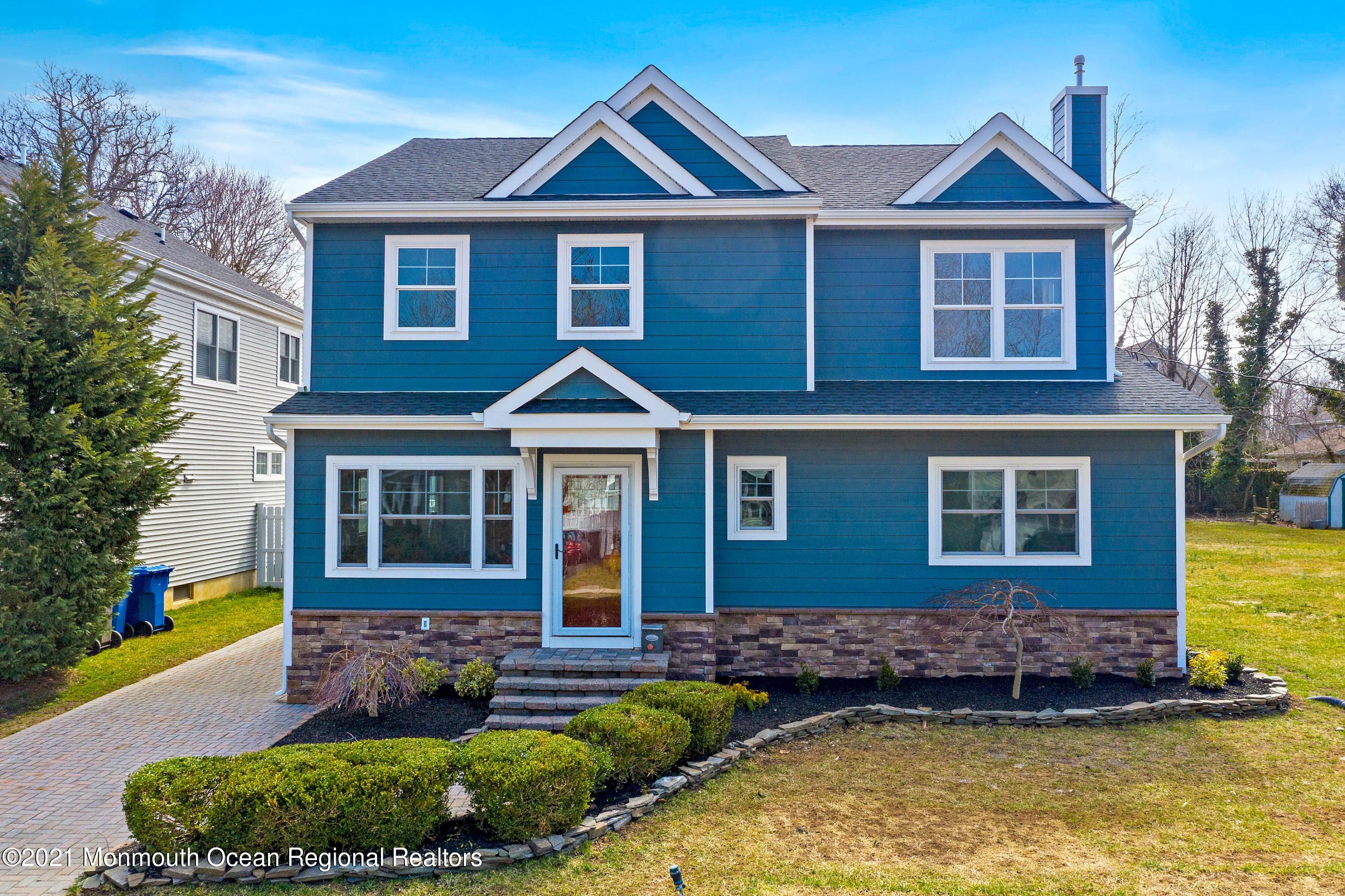 94 Jackson Street Fair Haven, NJ 07704 - Photo 82 of 83 a front view of a house with a yard and potted plants