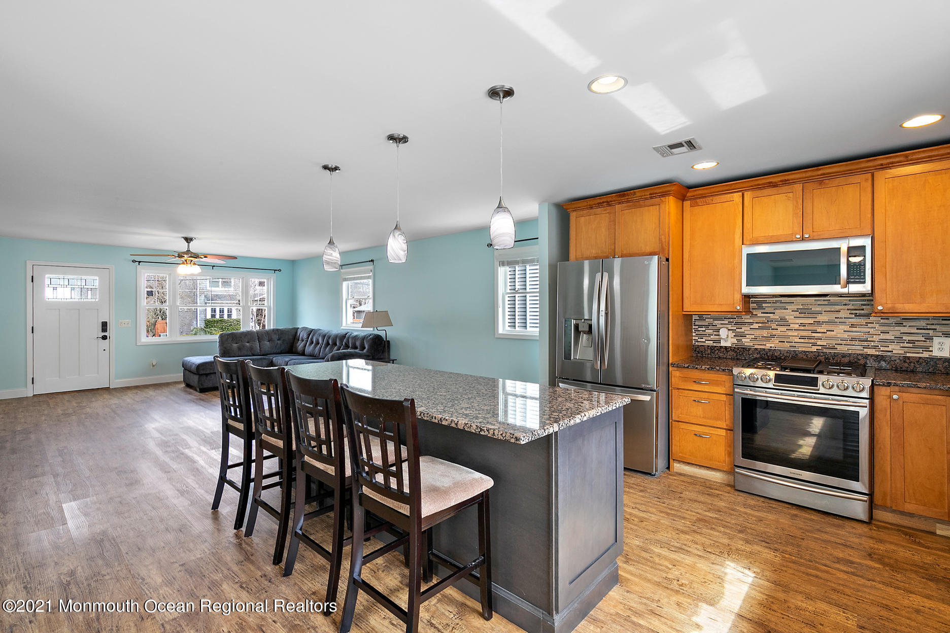 94 Jackson Street Fair Haven, NJ 07704 - Photo 10 of 83 a kitchen with stainless steel appliances granite countertop a stove a sink a refrigerator a dining table and chairs
