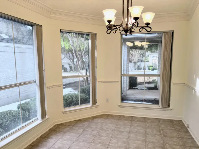 a bathroom with a light fixture and a mirror