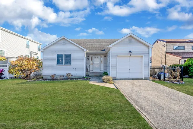 a front view of house with yard