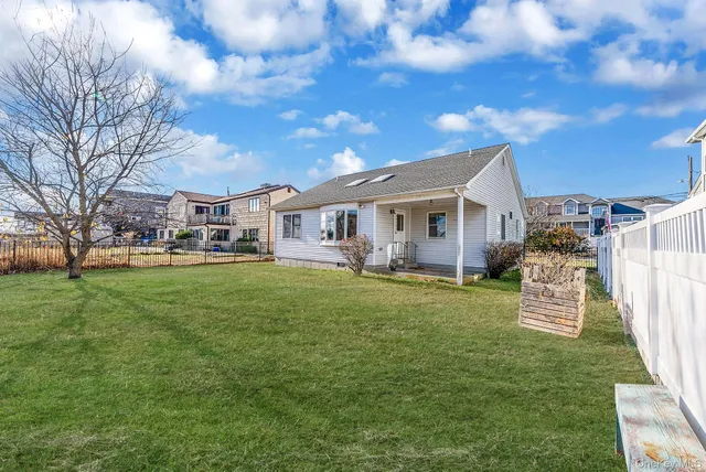 a view of a house with a back yard