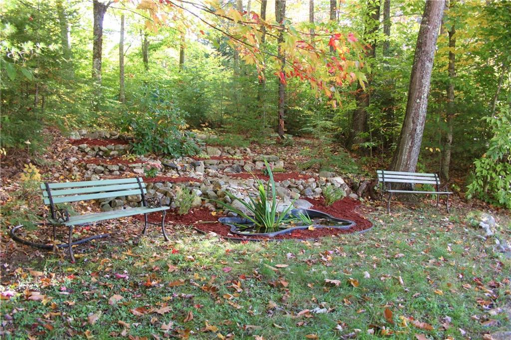 207 Jack Hall Road New Gloucester, ME 04260 - Photo 21 of 42 Quaint sitting area with pond, set...
