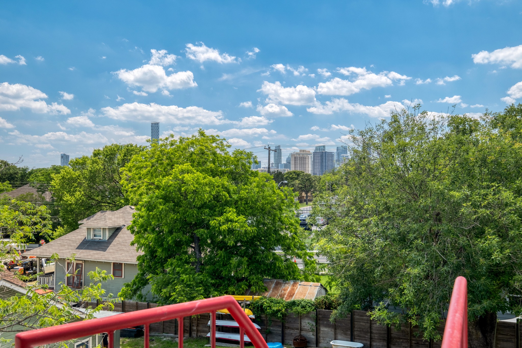 1904 East 16th Street, Unit 2 Austin, TX 78702 - Photo 20 of 20 City skyline visible over mature trees