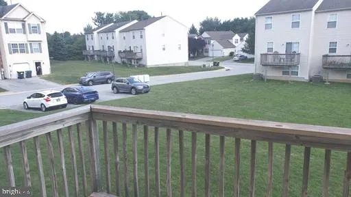 a view of a porch with furniture and garden
