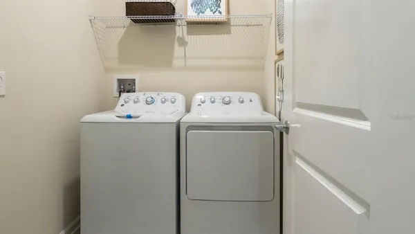 a utility room with dryer and washer