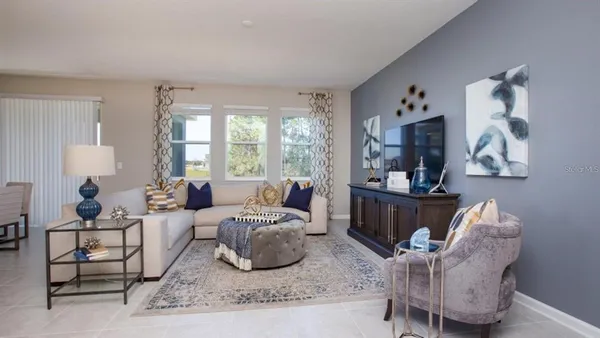 a living room with furniture and a window