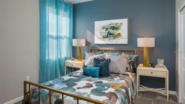 a bed room with furniture and a window