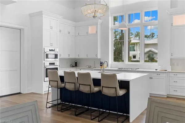 a kitchen with a sink cabinets and window