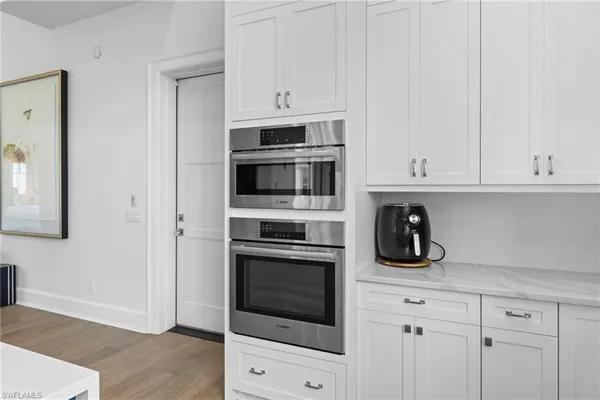 a kitchen with a sink cabinets and window