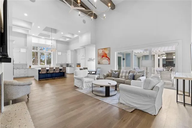 a living room with fireplace furniture and a wooden floor