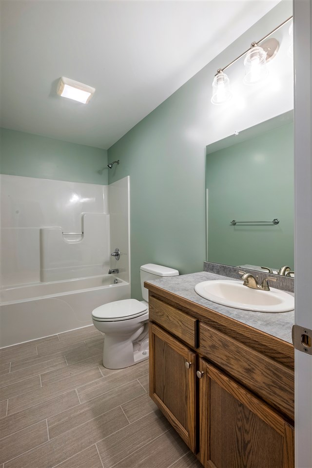 8 North Point School Road Waynesboro, VA 22980 - Photo 13 of 40 a bathroom with a granite countertop sink a toilet and a bathtub