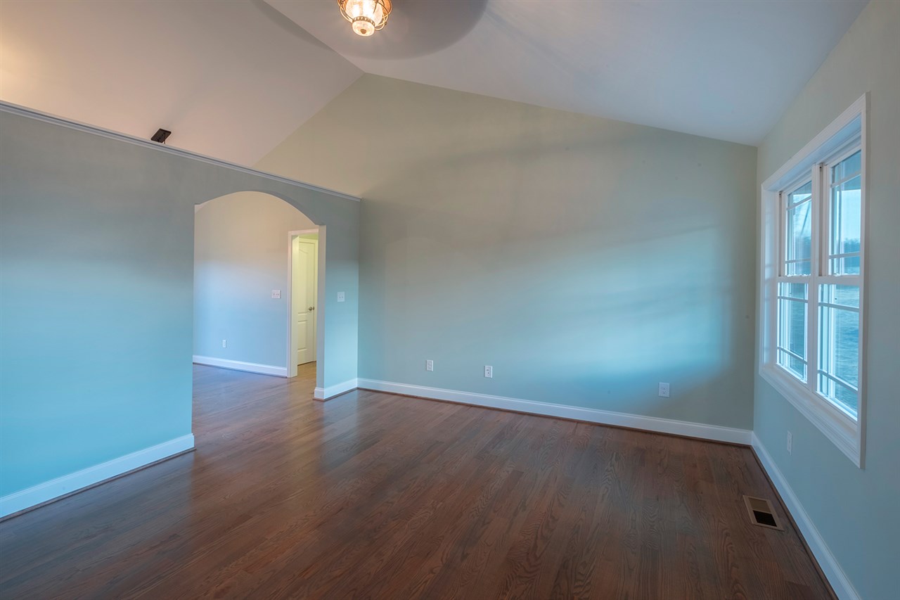 8 North Point School Road Waynesboro, VA 22980 - Photo 5 of 40 an empty room with wooden floor and windows