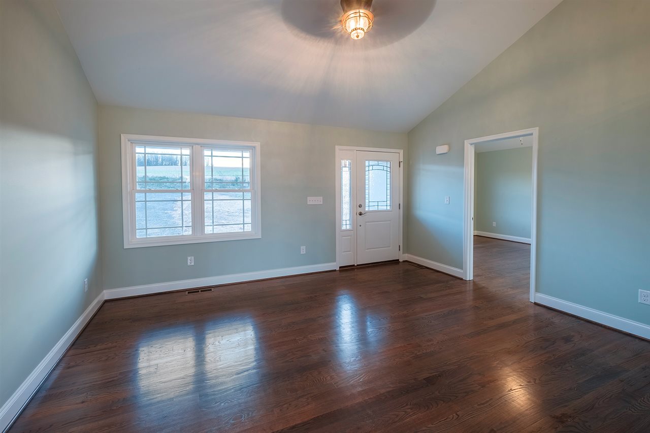 8 North Point School Road Waynesboro, VA 22980 - Photo 6 of 40 an empty room with wooden floor and windows