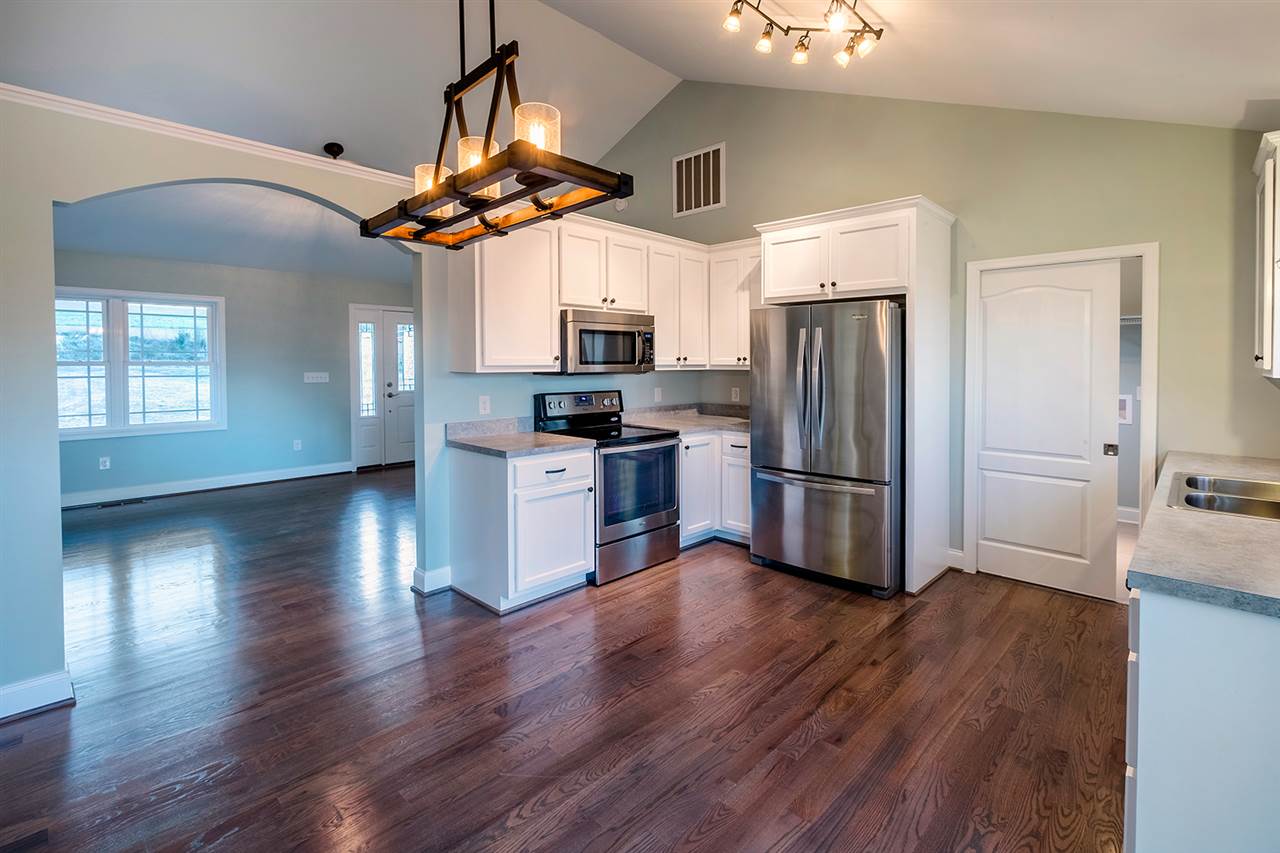 8 North Point School Road Waynesboro, VA 22980 - Photo 8 of 40 a kitchen with stainless steel appliances granite countertop a refrigerator a microwave oven a sink dishwasher and wooden floor