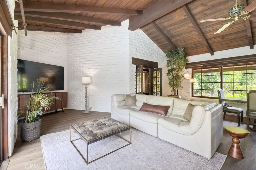 762 Hamilton Lane Fallbrook, CA 92028 - Photo 11 of 39 a living room with furniture and a flat screen tv