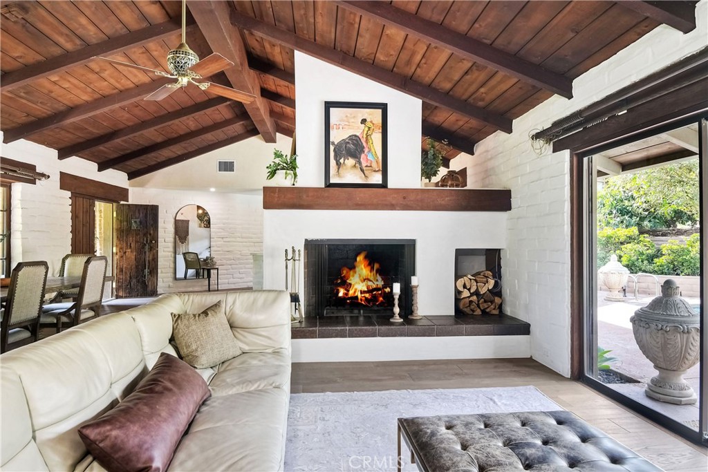 762 Hamilton Lane Fallbrook, CA 92028 - Photo 12 of 39 a living room with furniture and a fireplace