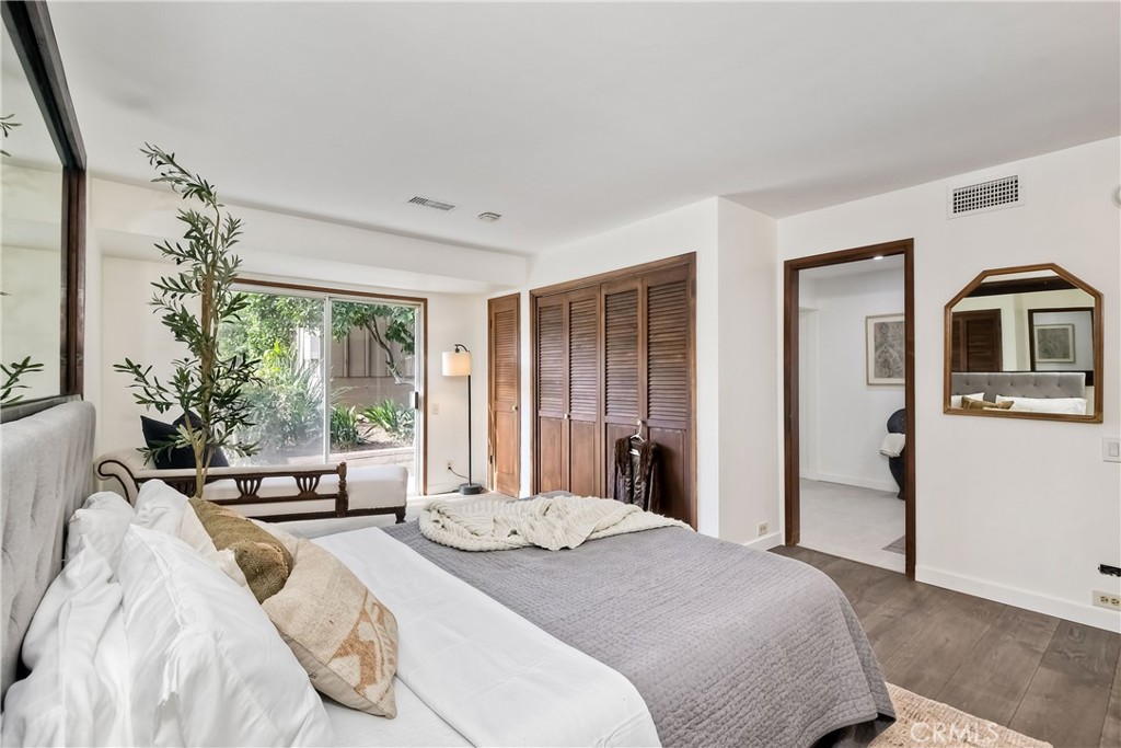 762 Hamilton Lane Fallbrook, CA 92028 - Photo 20 of 39 a bedroom with a bed and large windows