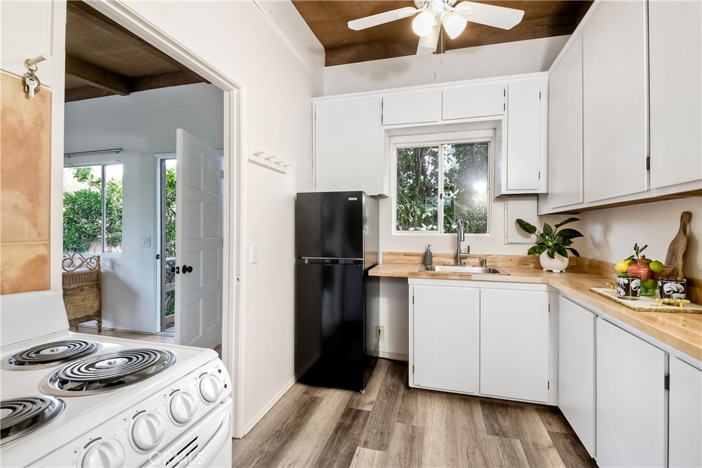 762 Hamilton Lane Fallbrook, CA 92028 - Photo 27 of 39 a kitchen with a sink stove and refrigerator