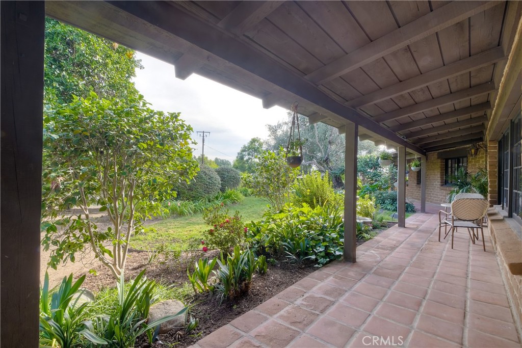 762 Hamilton Lane Fallbrook, CA 92028 - Photo 39 of 39 a view of a patio with table and chairs potted plants with floor to ceiling window
